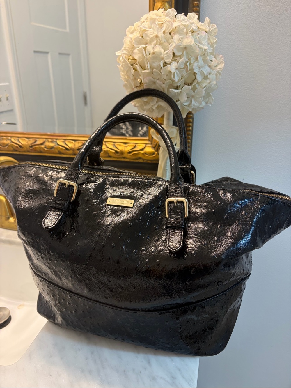 Kate Spade’s Portola Valley-Blaine satchel includes dust bag